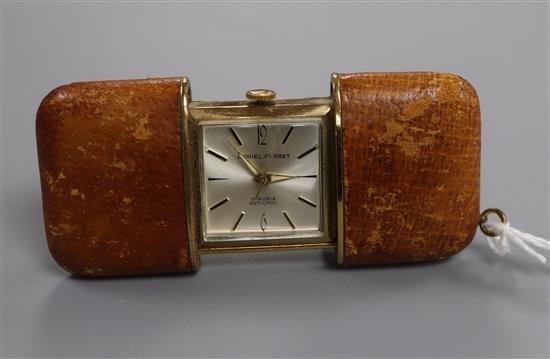 A Daniel Perret leather cased travelling watch